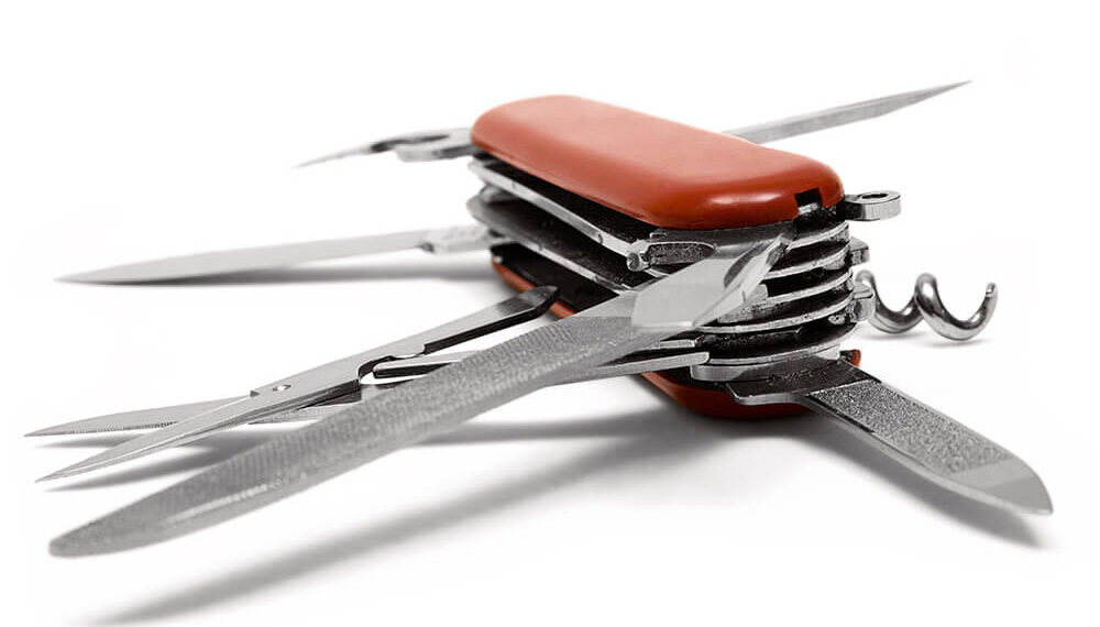 Red Multitool knife isolated on a white background.