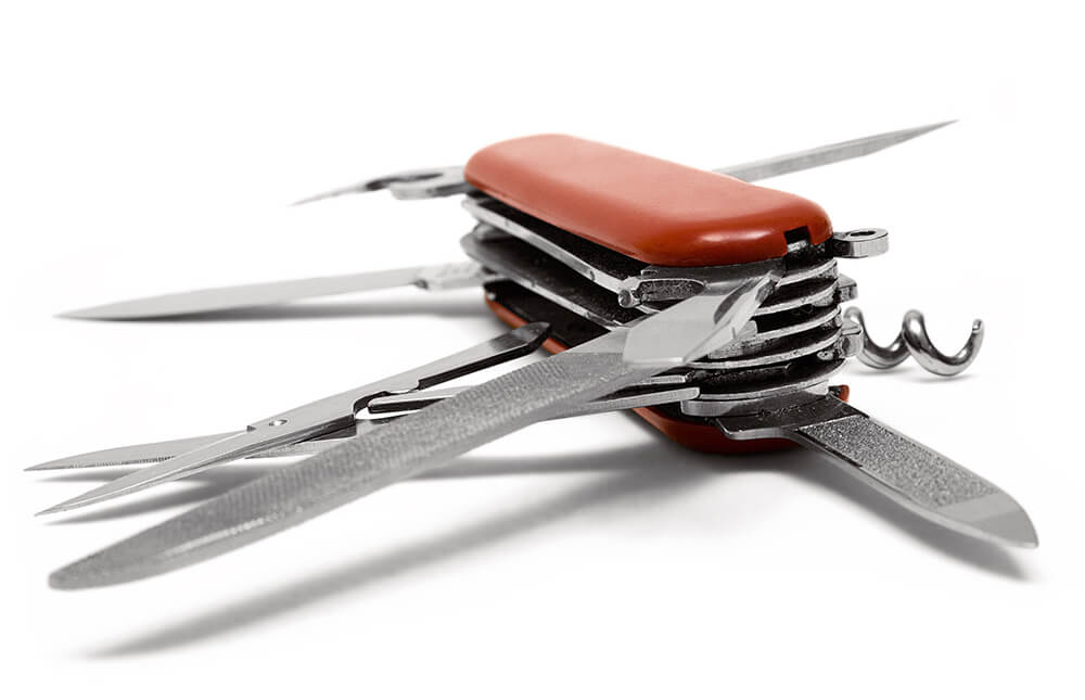 Red Multitool knife isolated on a white background.